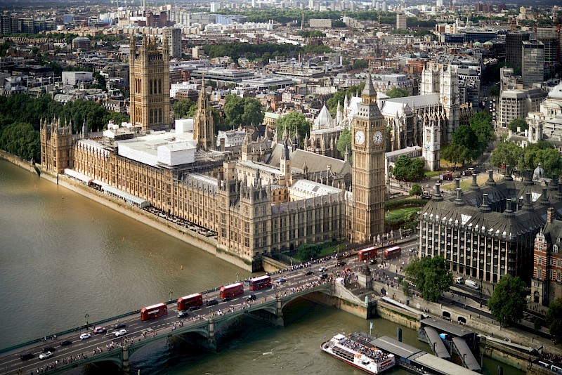 Aerial view of Westminster Palace and adjacent Big Ben, London, England. Unsplash:Maxim Melnikov