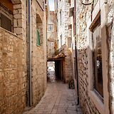 Cobbled stone alley in Hvar, Croatia. hakon grimstad@Unsplash