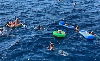 Jumping right off the ship for a swim