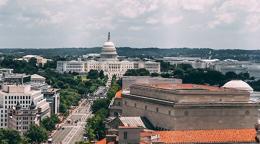 Constitution Avenue with Capitol Hill in the background. Unsplash:Vlad Tchompalov