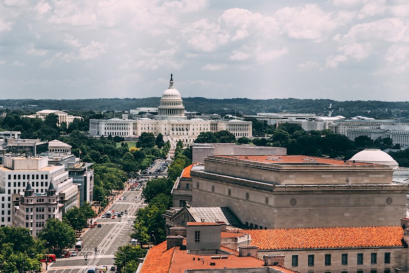 Constitution Avenue with Capitol Hill in the background. Unsplash:Vlad Tchompalov