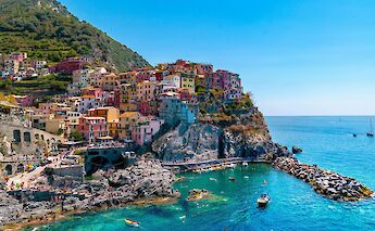 Colorful buildings of Manarola, Cinque Terre, Italy. Unsplash@Tom Podmore