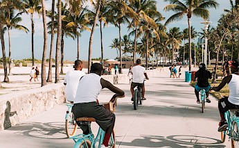 Cyclists on Miami Beach. Unsplash:Juan Rojas
