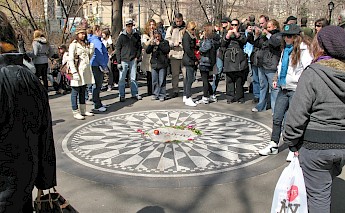 People gathered at the John Lennon Memorial. Unsplash:Robert Linder