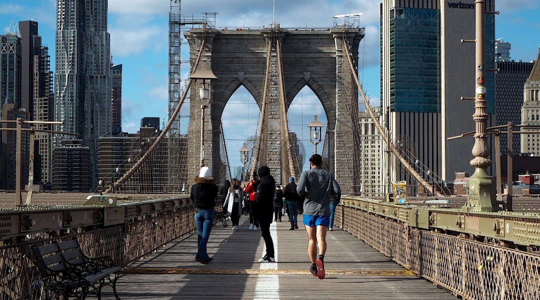 Pedestrians crossing the Brooklyn Bridge, NYC. Unsplash:David Jones