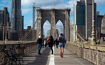 Pedestrians crossing the Brooklyn Bridge, NYC. Unsplash:David Jones