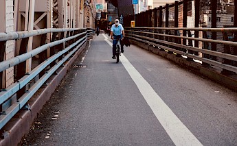 Cycling in the streets of NYC. Unsplash:Johny Vino