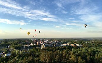 Hot air balloons over Vilnius, Lithuania. Unsplash@Reza Bina