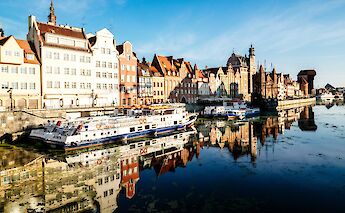 Barges on the water in Gdansk, Poland. Unsplash@Andrea Anastasakis