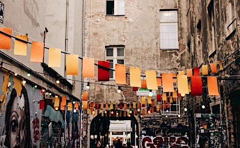 Bunting in a Berlin street, Germany. Pablo Hermoso@Unsplash