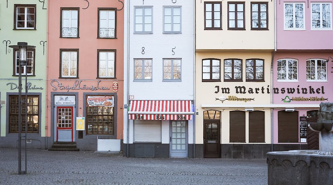 Coloured shops, Cologne, Germany. Unsplash:Kevin Martin Jose
