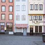 Coloured shops, Cologne, Germany. Unsplash:Kevin Martin Jose