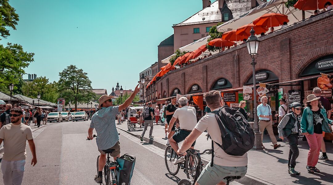 Guide pointing out sights on the bike tour, Munich, Germany. CC:Radius Tours
