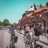 Guide pointing out sights on the bike tour, Munich, Germany. CC:Radius Tours