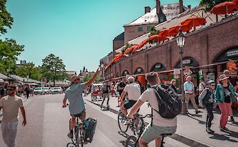 Guide pointing out sights on the bike tour, Munich, Germany. CC:Radius Tours