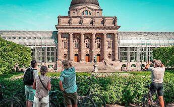 Listening to the tour guide, Munich, Germany. CC:Radius Tours