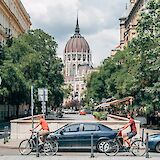People riding bike through the centre of Budapest. Unsplash:Ljubomir Zarkovic