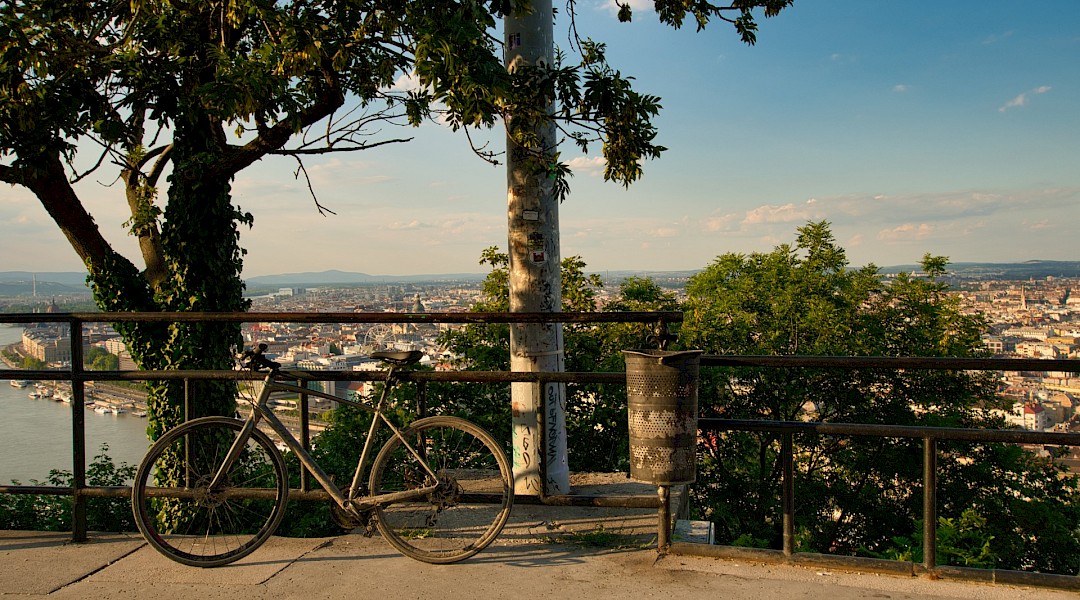 Bike parked on the Gellert Hill, overlooking Budapest. Unsplash:Gabor Koszegi