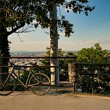 Bike parked on the Gellert Hill, overlooking Budapest. Unsplash:Gabor Koszegi