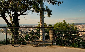 Bike parked on the Gellert Hill, overlooking Budapest. Unsplash:Gabor Koszegi