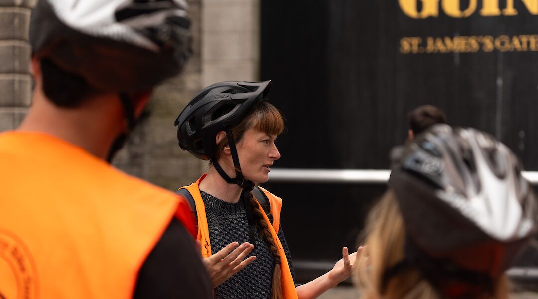 Guide talking about the Guinness Brewery, Dublin, Ireland. CC:Lazy Bike Tours