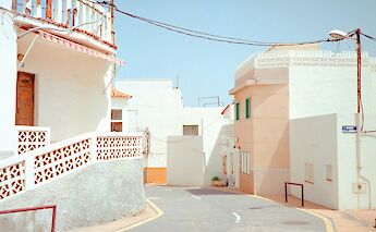 White buildings along a road in Marbella, Spain. Unsplash:Janke Laskowski
