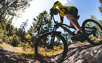 Mountain biking tour. Unsplash:Tobias Bjerknes