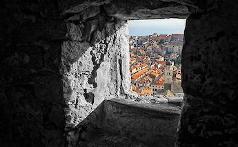 Dubrovnik viewed through an ancient window, Croatia. Mike Swigunski@Unsplash