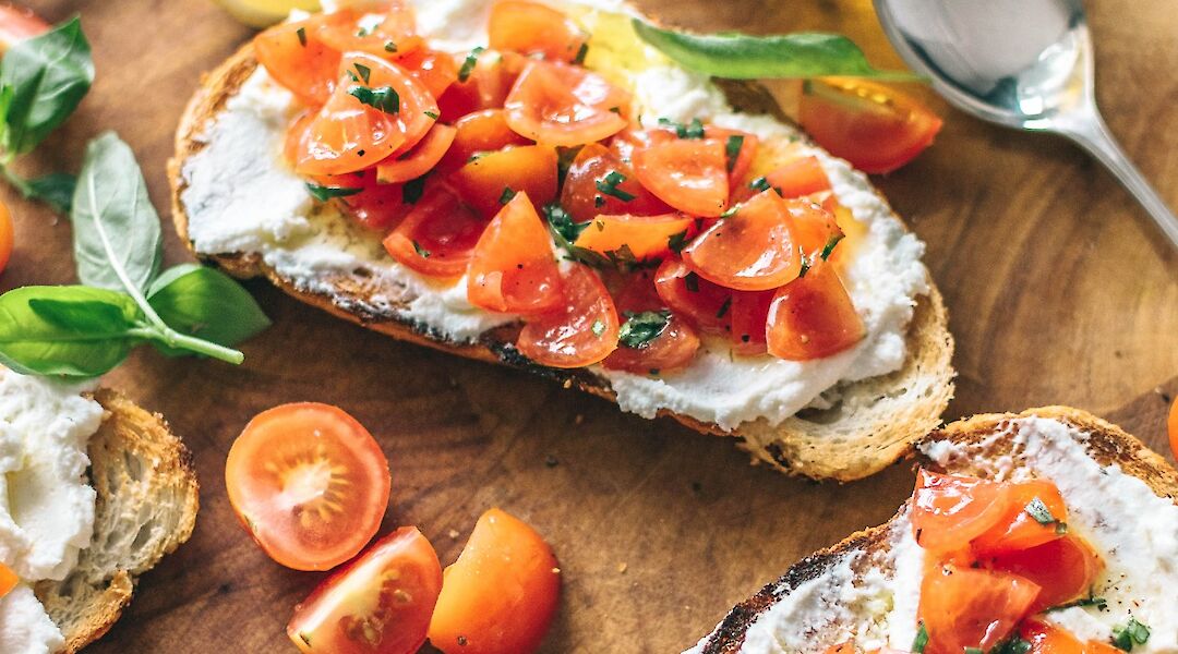 Local delicacies - fresh tomatoes and olive oil bruschetta. Unsplash:Calum Lewis