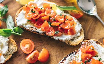 Local delicacies - fresh tomatoes and olive oil bruschetta. Unsplash:Calum Lewis