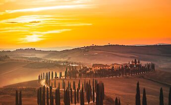 Sunset at Tuscany village. Unsplash:Jarno Cobbaert