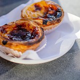 Pasteis de nata - Portuguese custard tarts. Unsplash:Hector John Peruquin
