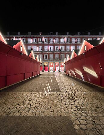 Stands of the Christmas Market, Closed for the Night. Plaza Mayor, Madrid, Spain. Unsplash: Alev Takil