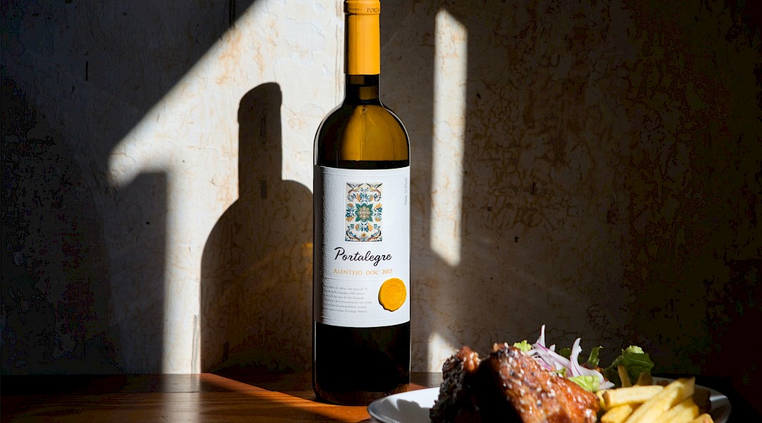 Food and Portuguese white wine. Unsplash:Maria Das Dores