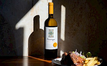 Food and Portuguese white wine. Unsplash:Maria Das Dores