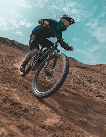 Mountain Biking. Unsplash: Fernando Munoz