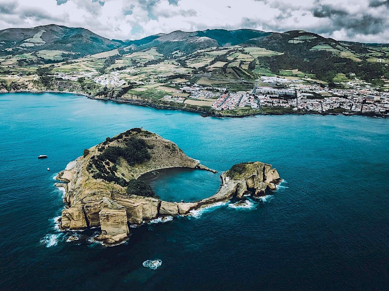 Swimming in a volcanic crater, Azores, Portugal. Unsplash:Ferdinand Stohr