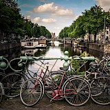 Bikes on of the many bridges over canals, Amsterdam. Unsplash:Jace Afsoon