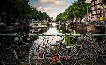 Bikes on one of the many bridges over the canals, Amsterdam, Holland. Jace Afsoon@Unsplash