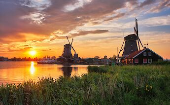 Windmills at sunset, Holland. Getty Images@Unsplash