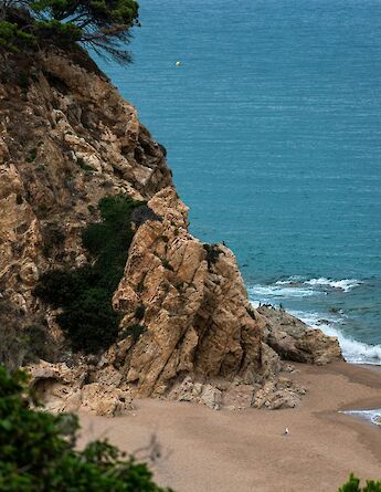 Beach in Calella de Palafurgell, Spain. Unsplash:Nikola Tasic