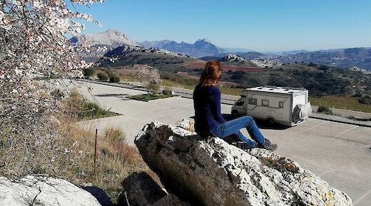 Sitting on a rock looking at Gavarres Massif, Spain. Unsplash:Julian Ackroyd