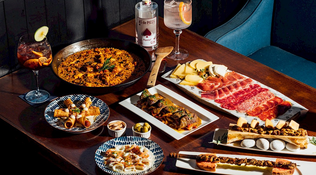 A variety of Spanish tapas, along with other traditional Spanish food. Unsplash:Chuttersnap