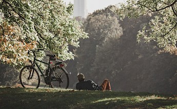 Relaxing in a park after a ride, Brussels. Unsplash:Norali Nayla