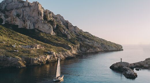 Sailboat on tranquil waters, Marseille, France. Mathieu da Cruz@Unsplash