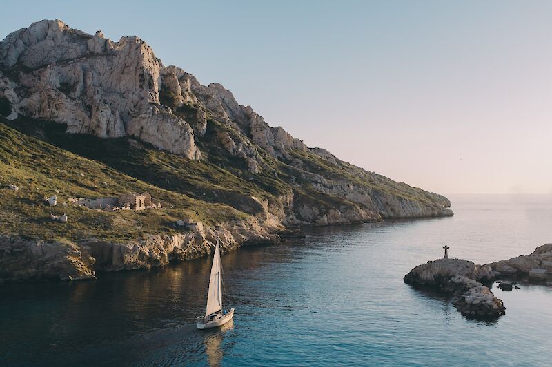 Sailboat on tranquil waters, Marseille, France. Mathieu da Cruz@Unsplash