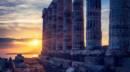 The sun setting behind the pillars, Athens, Greece. Getty Images@Unsplash