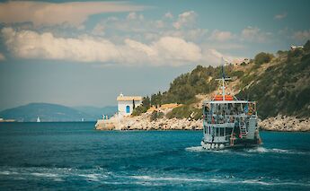 Ferry off coast of Kefalonia, Greece. Unsplash: Raimond Klavins