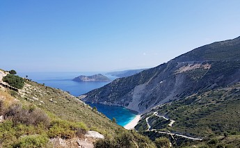 Beautiful scenery of a curvy road taking to a white-sand beach, Kefalonia. Evan Verni@Unsplash