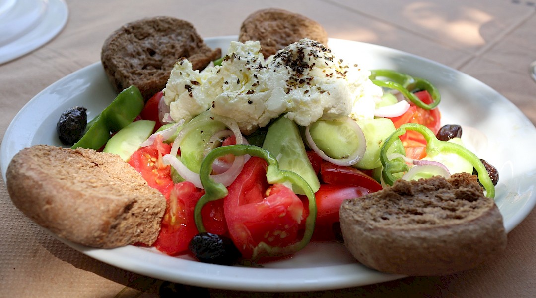 Greek salad with feta cheese on top. Yevheniia@Unsplash